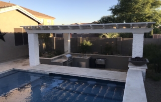 18 Pool with a pergola-covered outdoor kitchen and fire bowls