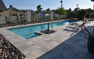 9 Long rectangular pool with travertine decking and loungers