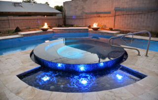 OP195 Round raised spa with blue LED lighting and fire bowls
