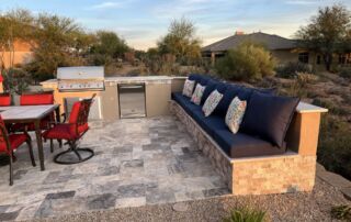 IMG_4226 Outdoor kitchen with grill, built-in cushioned bench seating and a patio dining set